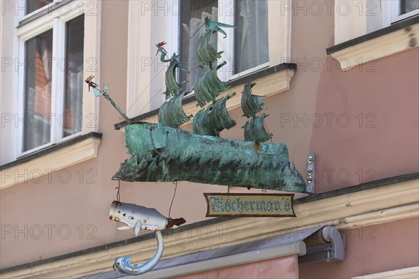 Sailing ship as a nose sign of an inn