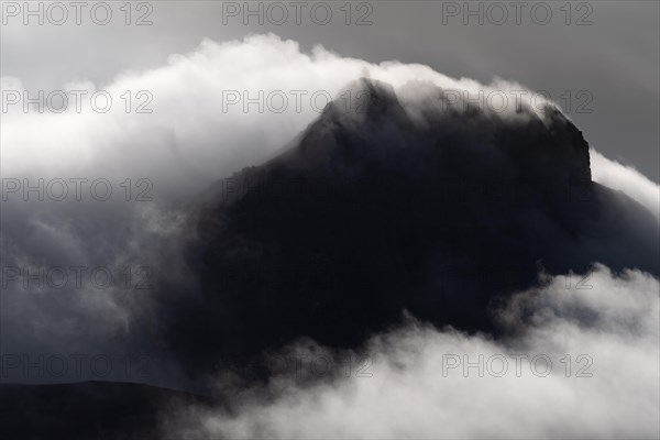Cloudy craggy mountain