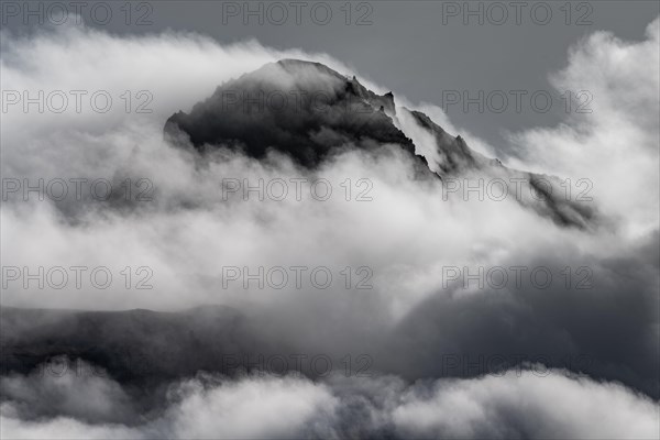 Cloudy craggy mountain