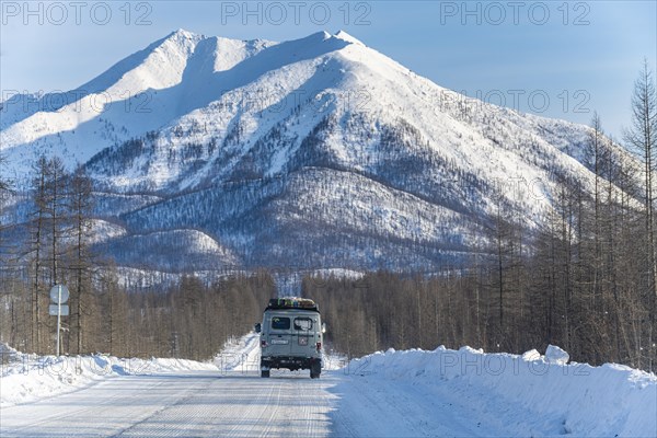 Minivan driving on the Road of Bones