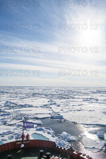 People enjoying the breaking ice on board of an icebreaker