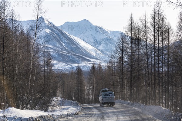 Minivan driving on the Road of Bones