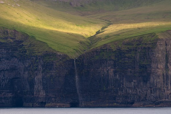 Waterfall falling over steep cliffs