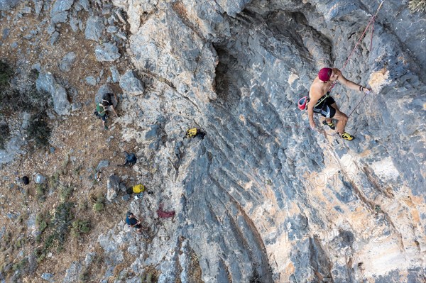 Climber climbing on a rock face