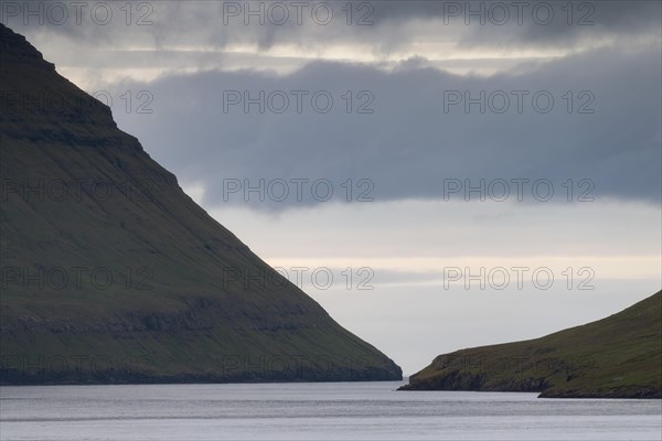 Mountain slopes dropping steeply into the sea
