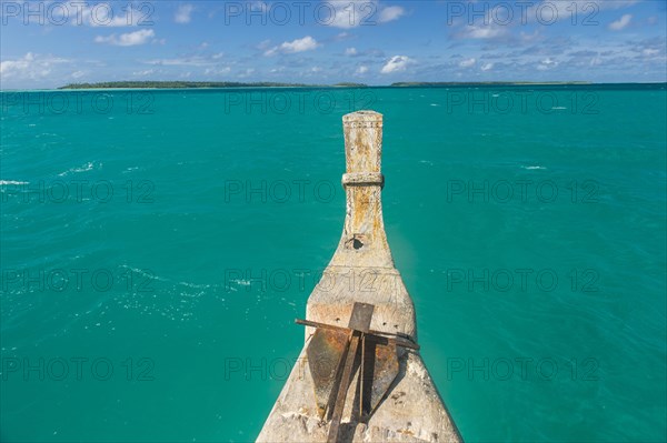 Traditional wood carved boat in the Aitutaki lagoon