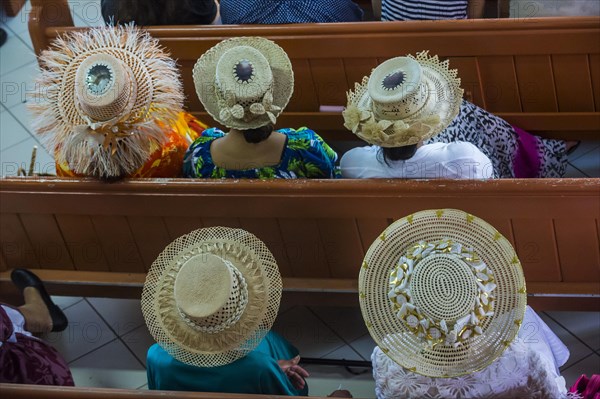 Women with traditional hats on a church service