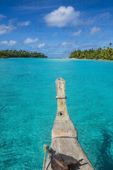 Traditional wood carved boat in the Aitutaki lagoon
