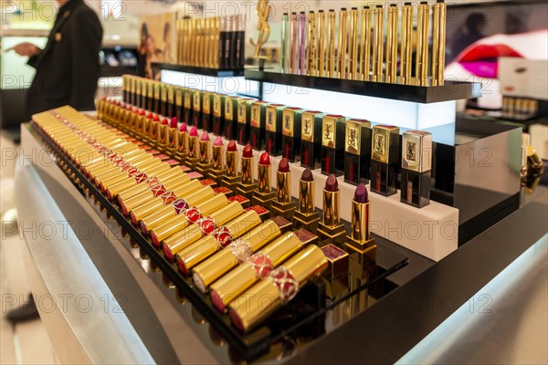 Lined up lipsticks in different shades of red