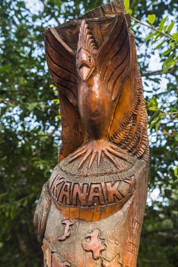 Hand carved wooden statues im the center of Noumea