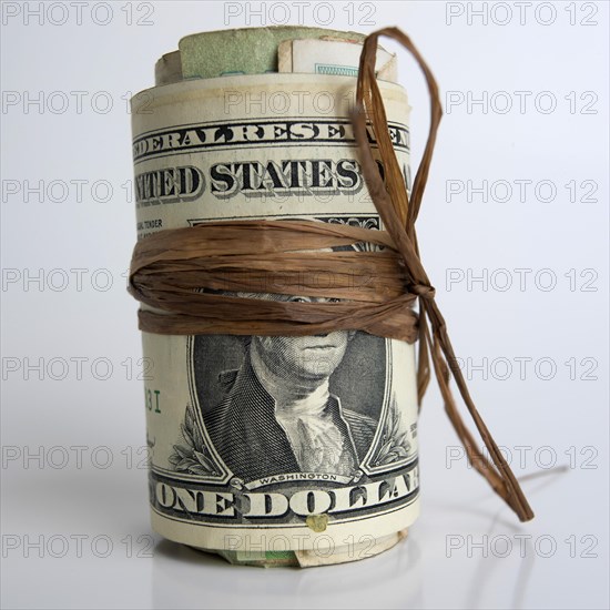 Roll of dollar banknotes