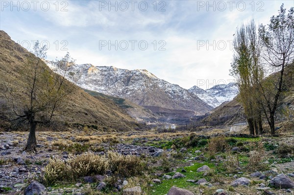 Beautiful valley with stream in Atlas mountain by sunset