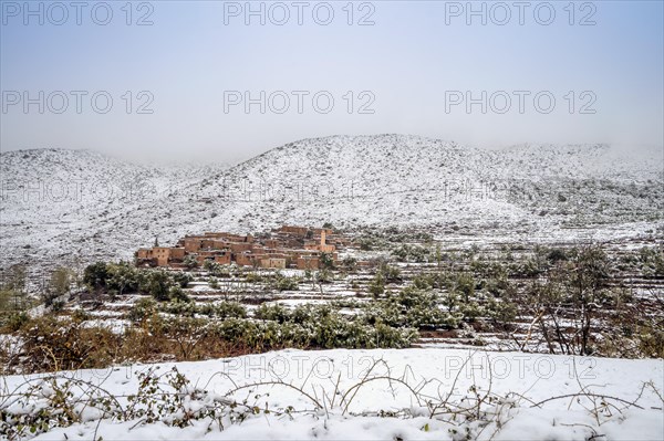 Remote Berber village after snow fall in Atlas mountains