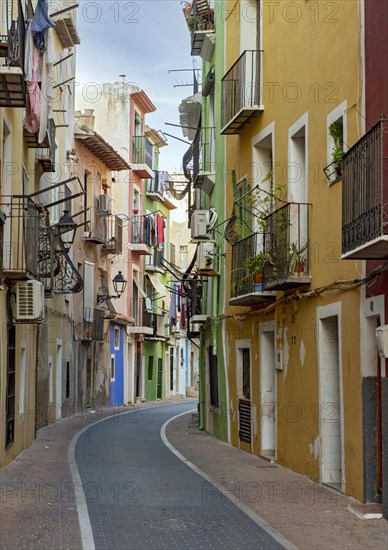 Narrow street with colorful houses in seaside town of Villajoyosa