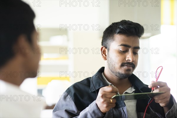Students in an internship at the university with work equipment