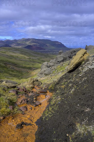 Stream coloured orange by iron oxide