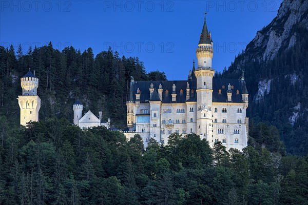 Illuminated Neuschwanstein Castle in the last evening light