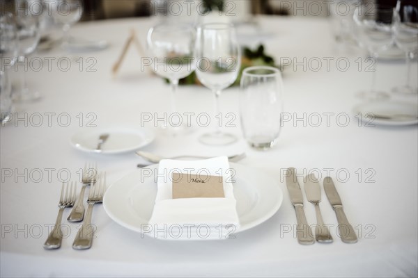 Table setting in a fancy restaurant before wedding reception