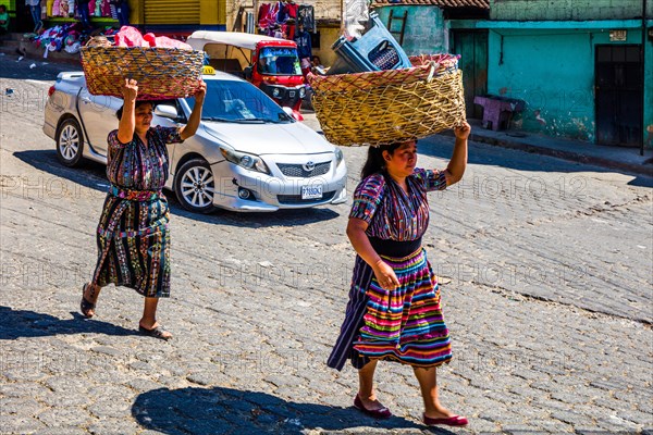Market woman with wrap skirt and colourful embroidered blouse
