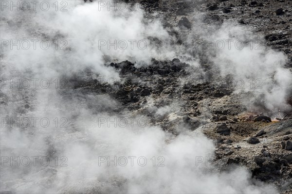 Steaming black volcanic soil