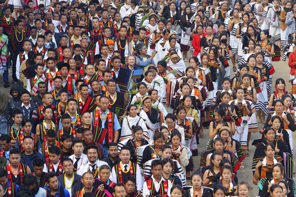 Naga tribesmen participating in the stone-pulling ceremony during the Kisima Nagaland Hornbill Festival