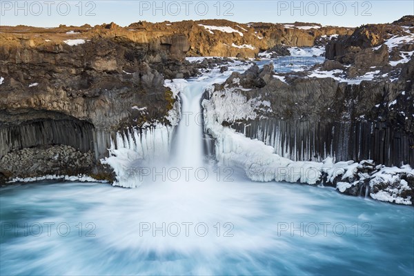Aldeyjarfoss waterfall by the SkjsslfandafljÂ¾t river in winter in the north-eastern region