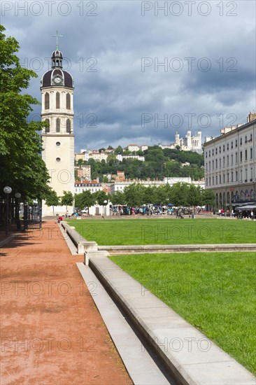 Bell tower of the former Hopital de la Charite and the Basilica Notre-Dame de Fourviere on the top of the hill