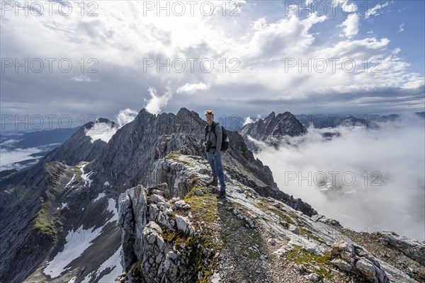 Hiker at the summit of the Westliche Toerlspitze