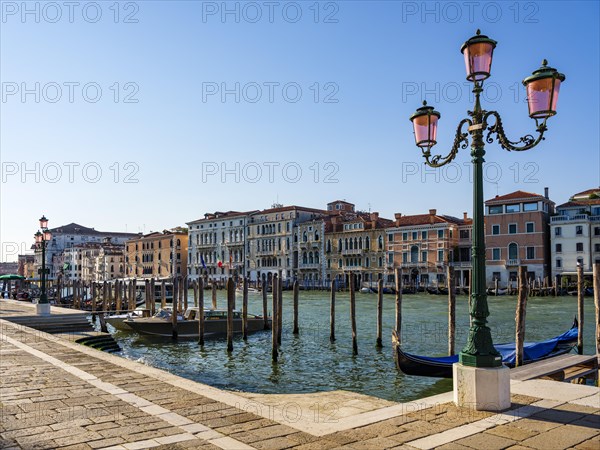 Boat mooring in front of historic house facade