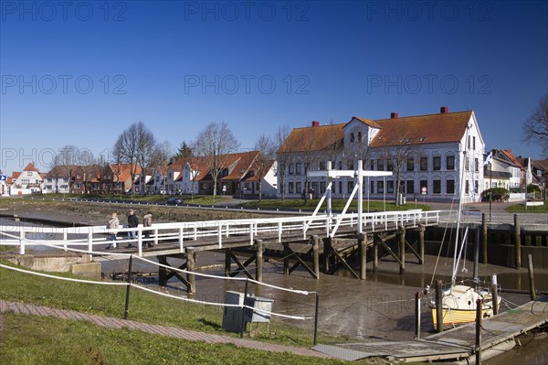 The old historic white bridge over the Toenning peat harbour