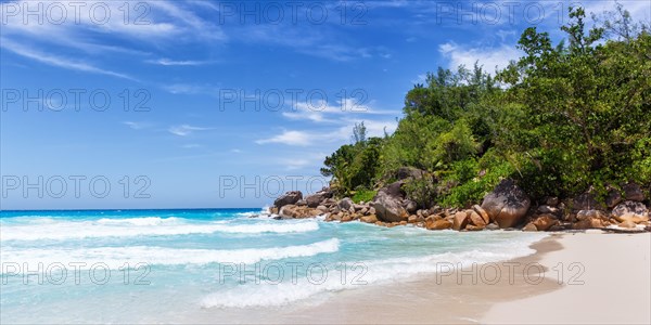 Anse Georgette Beach on Praslin Island with Palm Panorama Sea in the Seychelles