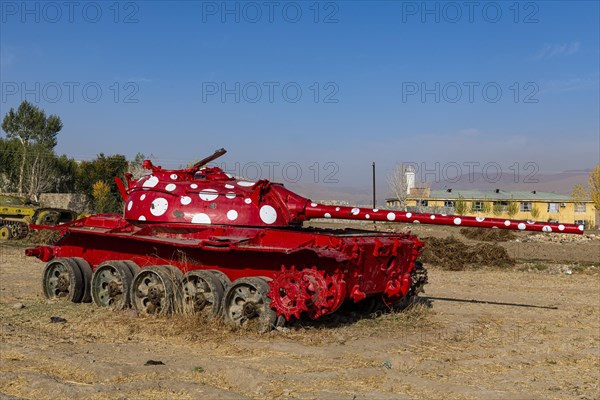 Old soviet tank coloured in funky colours