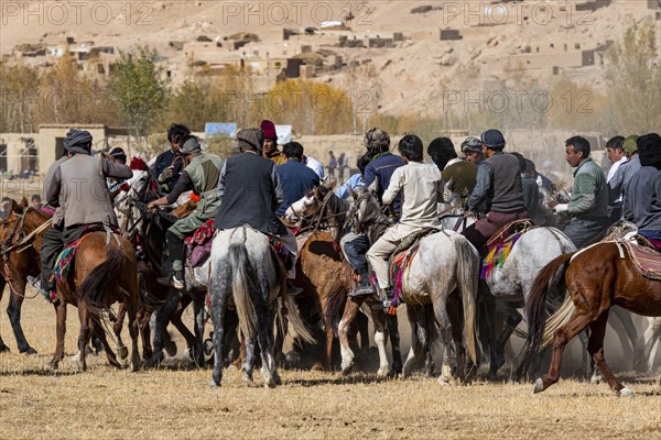 Men practising a traditional Buzkashi game