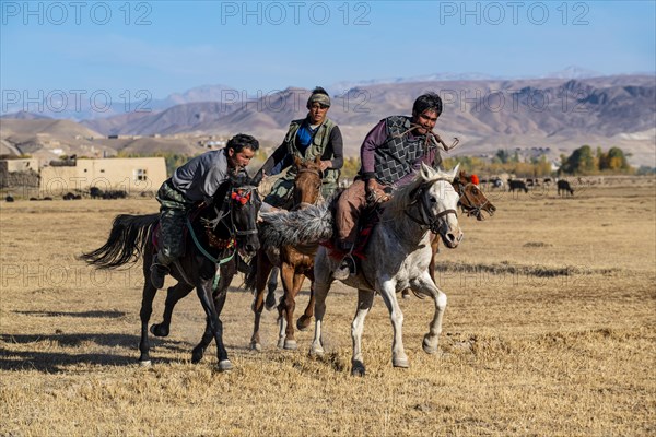 Men practising a traditional Buzkashi game