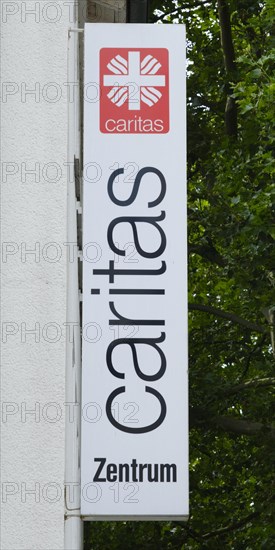 Sign and logo Caritas