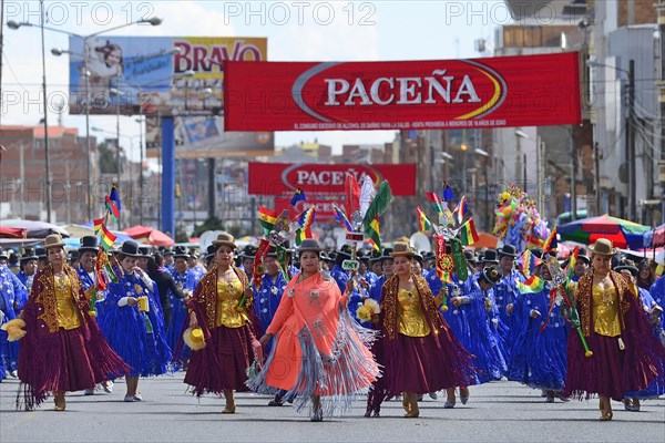 Dance group in traditional costumes at a parade