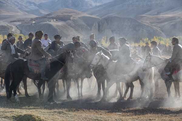 Men practising a traditional Buzkashi game