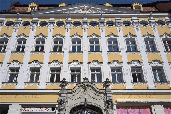 Facade with atlases