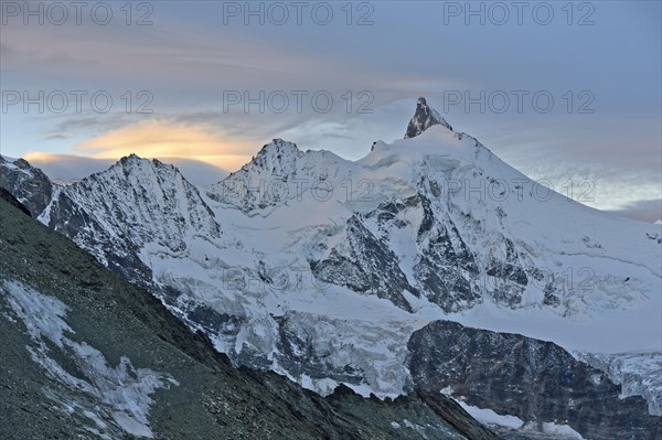 Sunset at the summit of Zinalrothorn