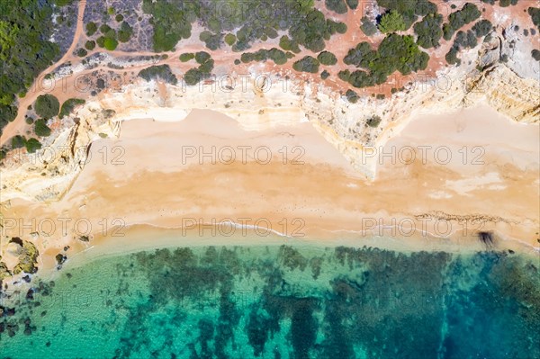 Portugal Algarve beach Praia da Marinha sea ocean drone shot from above in Praia da Marinha