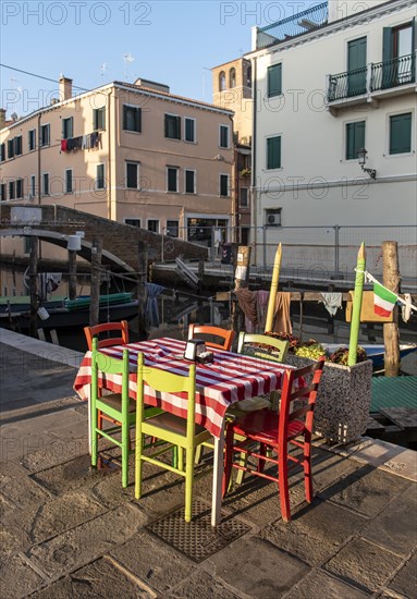Outdoor restaurant table by Canal Vena