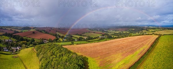 Rainbow over the Fields over Compton Castle from a drone