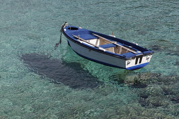 Rowing boat in crystal clear water