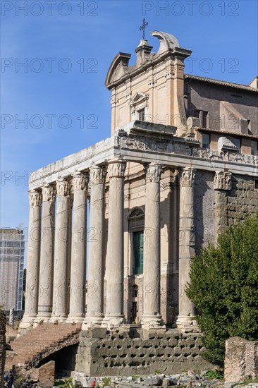 Historic facade of Temple of Pius and Faustina with staircase and ancient columns