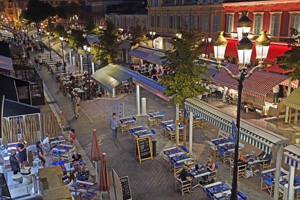 Evening hustle and bustle with restaurants and market stalls on the Cours Saleya