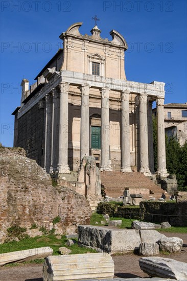 Historic facade of Temple of Pius and Faustina with staircase and ancient columns