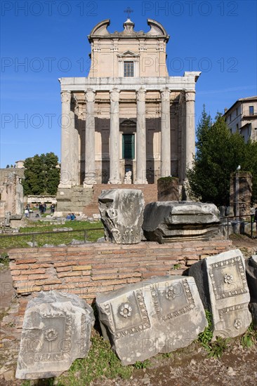Historic facade of Temple of Pius and Faustina with staircase and ancient columns