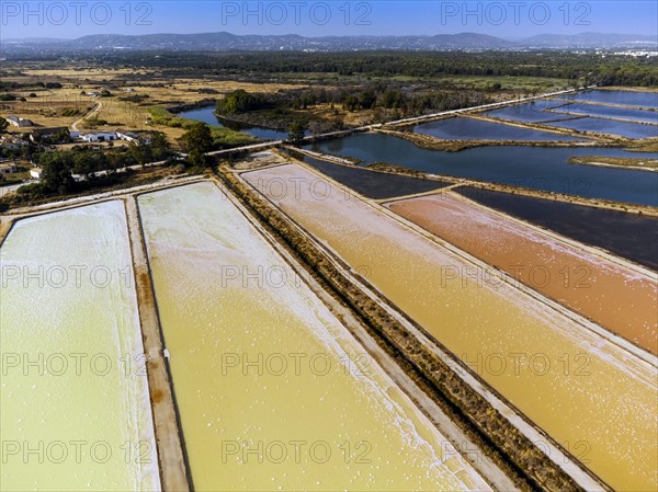 Amazing colors of sea salt ponds called salines shortly before salt extraction in Portugal