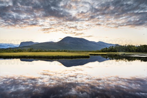 Mountains reflected in small lake