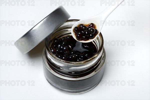 Aceto pearls in glass and spoon